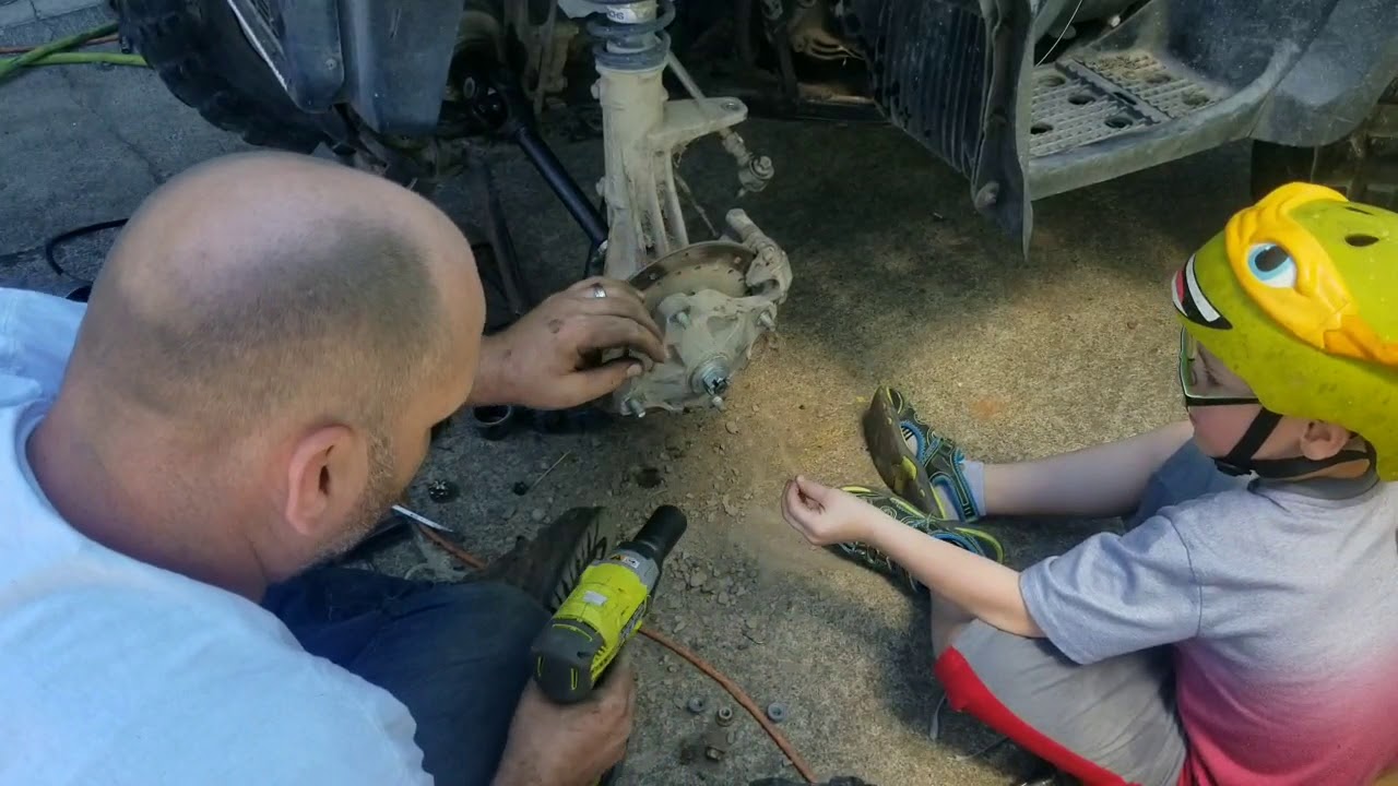 Easiest way to remove front axles Polaris 330 magnum