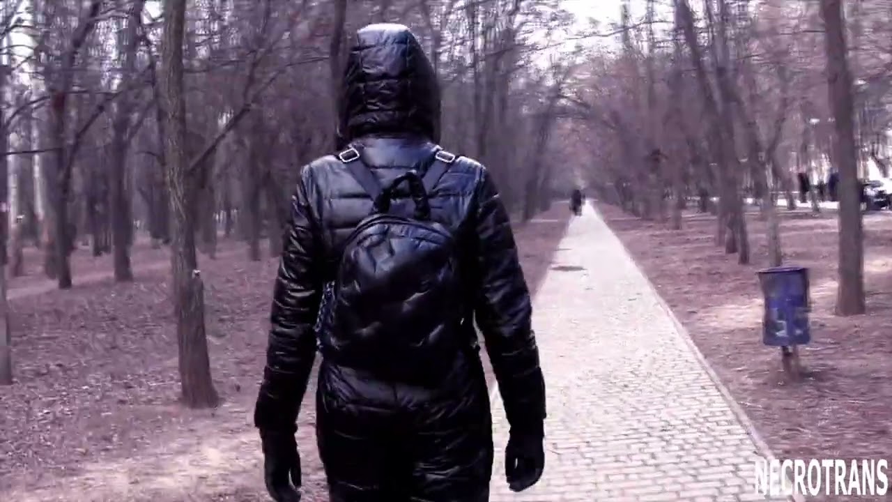 BLACK GLOSSY WARM SKI SUIT (SOLID WINTER SUIT) WITH HOOD AND MASK WITH RESPIRATOR AND GLASSES.