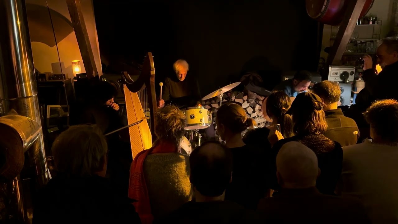 Marina Mello (harp), Maurice Louca (guitar) and Tony Buck (drums)