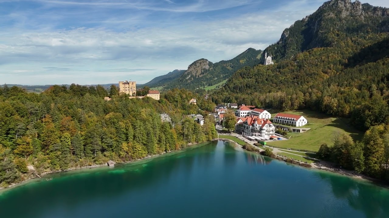 drone flight alpsee neuschwanstein bavaria alps clear water boats 70