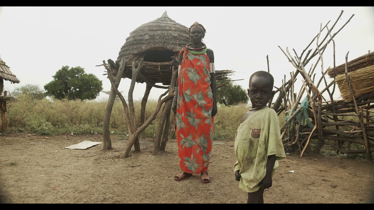 Toposa tribe woman in traditional clothing in a village, Namorunyang State, Kapoeta, South Sudan