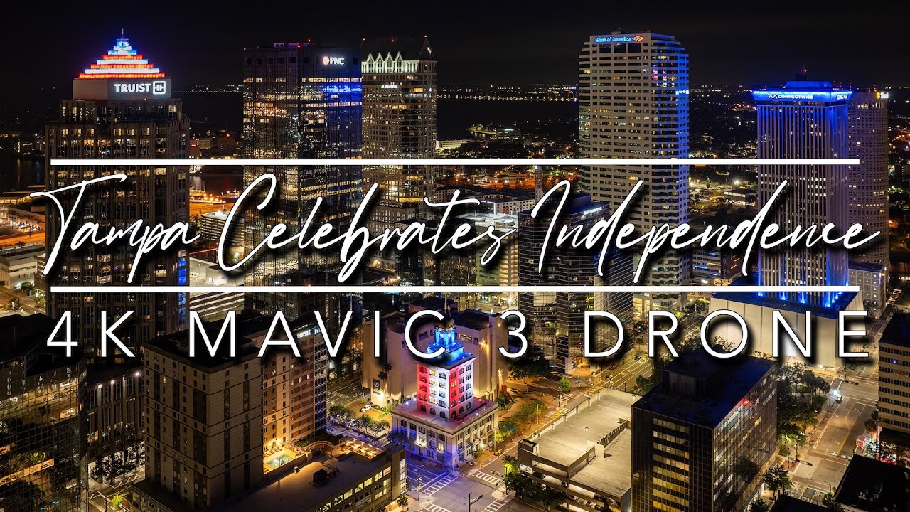 Drone View of Downtown Tampa Glowing Red, White & Blue at Night