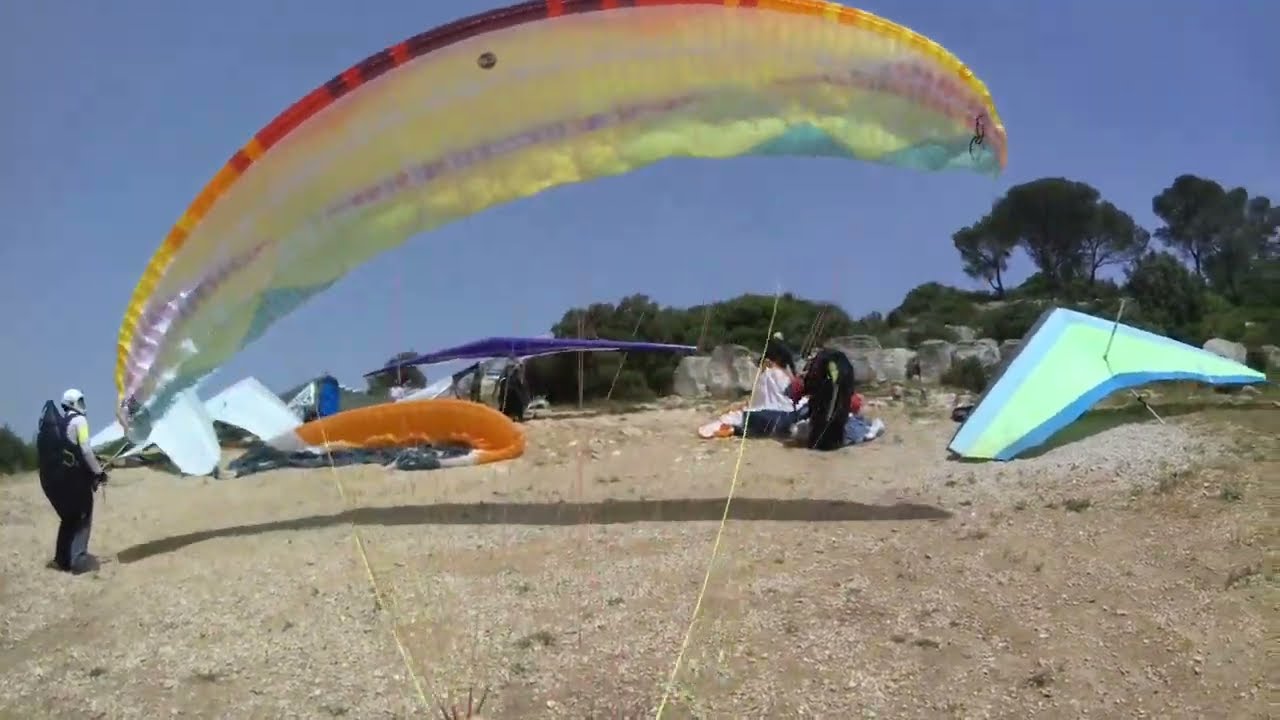 Flight in sand storm. Paragliding Israel Tavor mountain.