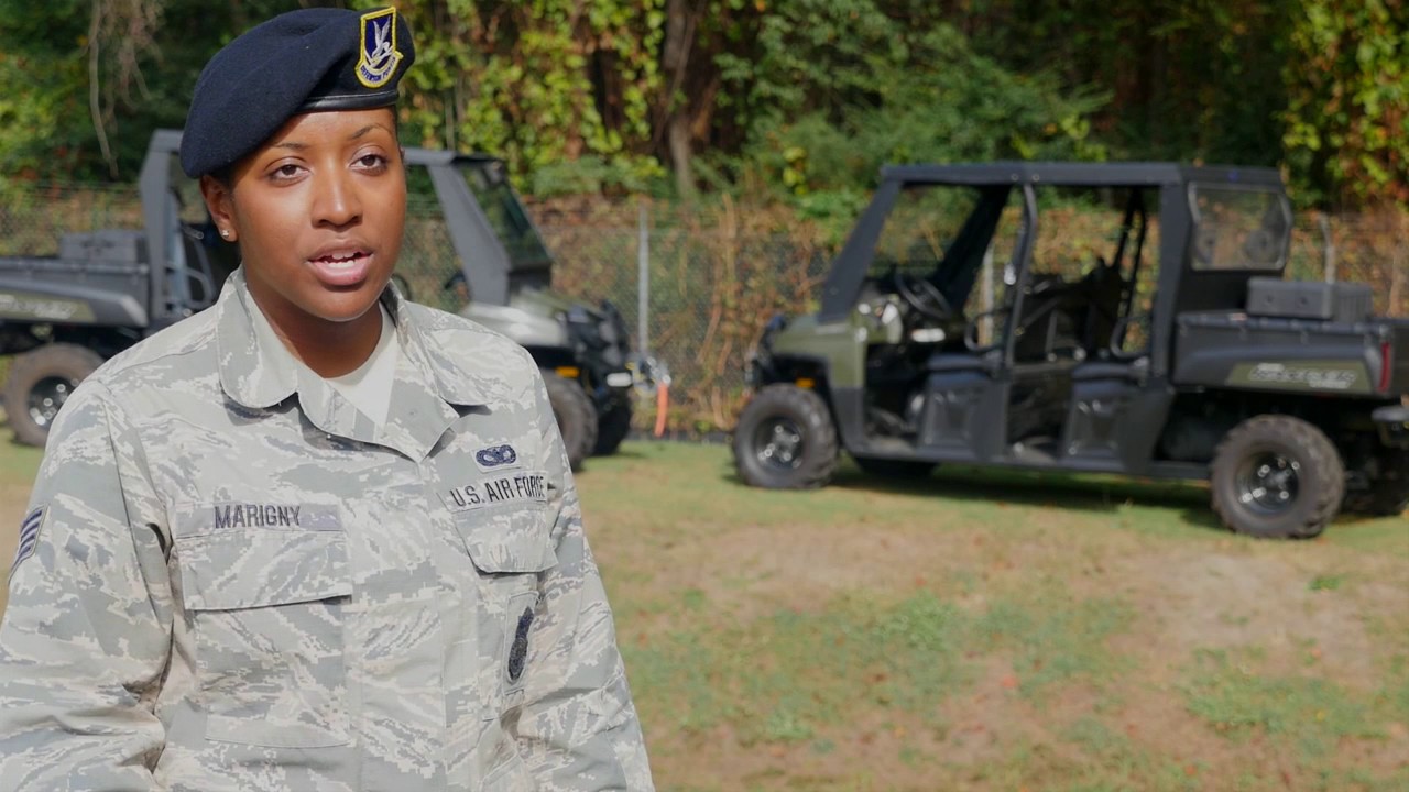 U.S. Airmen from the 116th Security Forces Squadron discuss the Security Forces career field