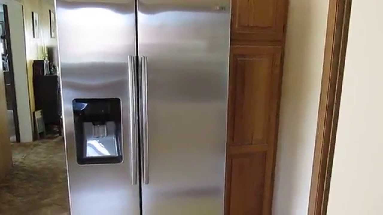 Samsung 24.7 cu. ft. Side by Side Refrigerator with Food Showcase Design RH25H5611SR