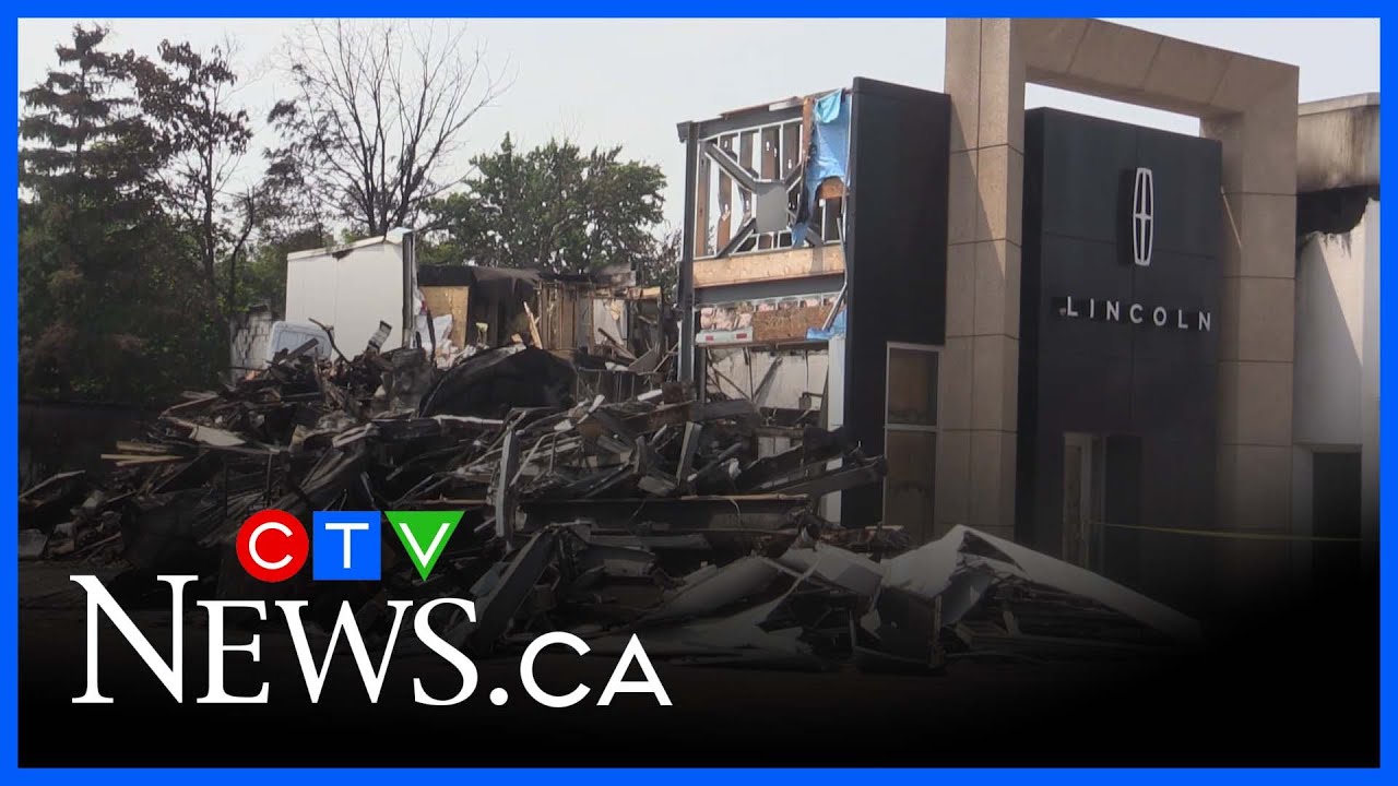Fire investigation continues at car dealership