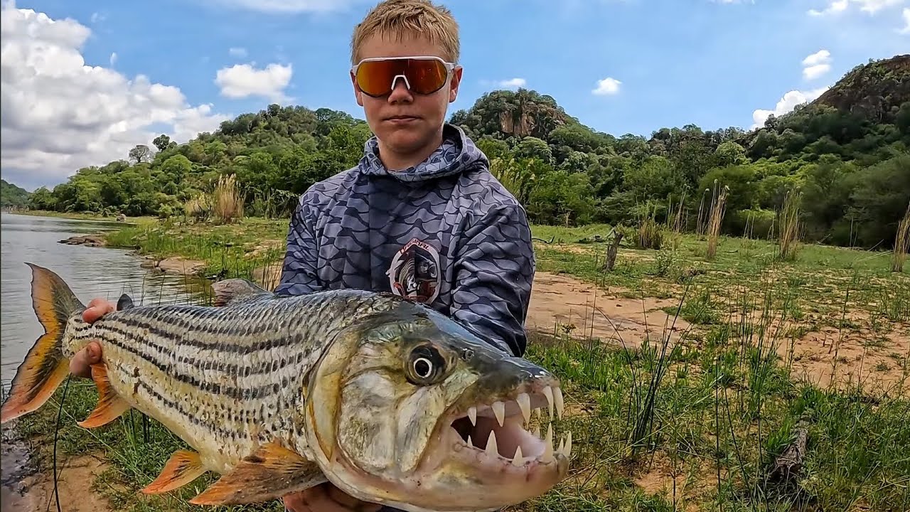 Fishing an African Lake for Aggressive Tiger Fish and Big Catfish in Clear Water!