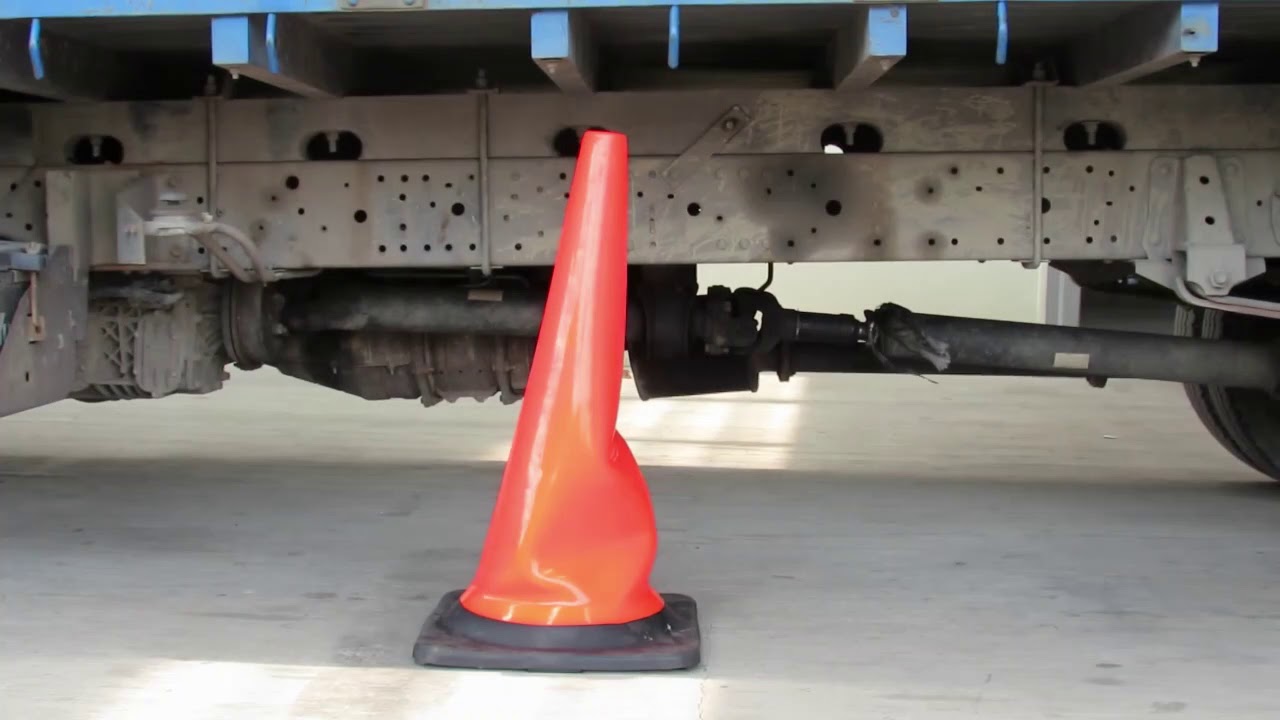 truck running over the traffic cone