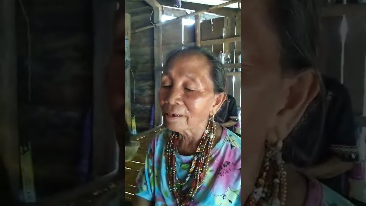 The North Borneo Bobohizan doing the rinait ritual for the sick person.