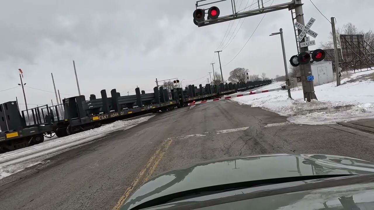 Train watching on a gloomy morning in Lima, Ohio.  CSX, CF&E, and NS
