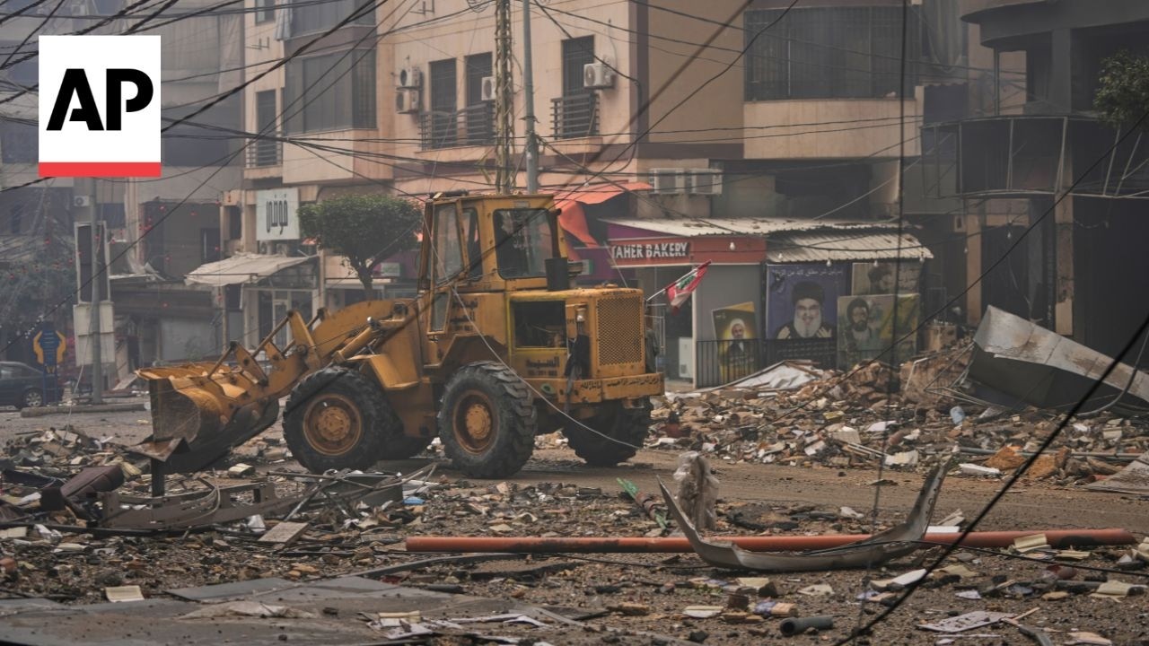 Workers remove debris in Beirut after Israeli strikes