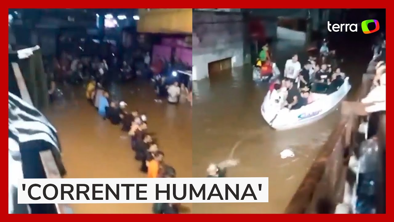 RS: Moradores fazem 'corrente humana' para resgatar pessoas ilhadas em Canoas