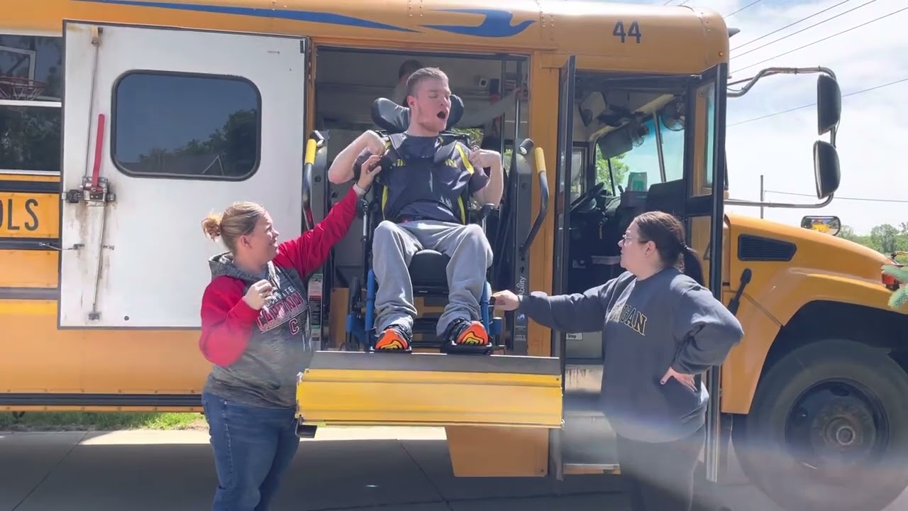 Sam getting off the school bus lift after school 5.25.23