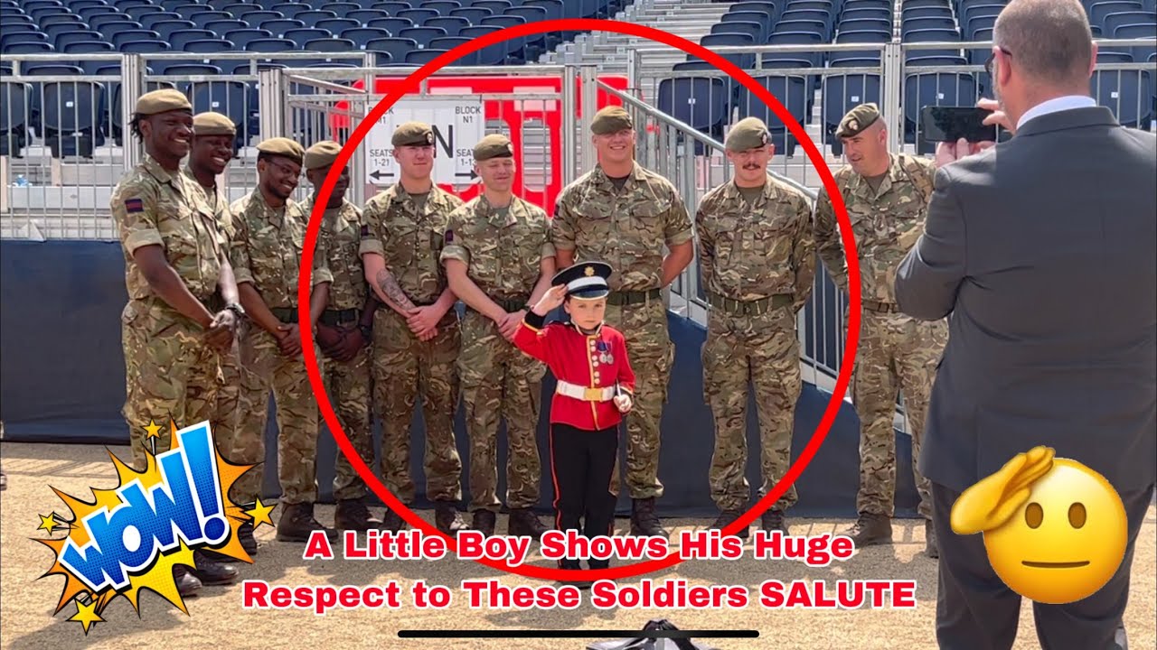 Sweet Little Boy Dressed As King’s guard has a great time chatting with these soldiers.