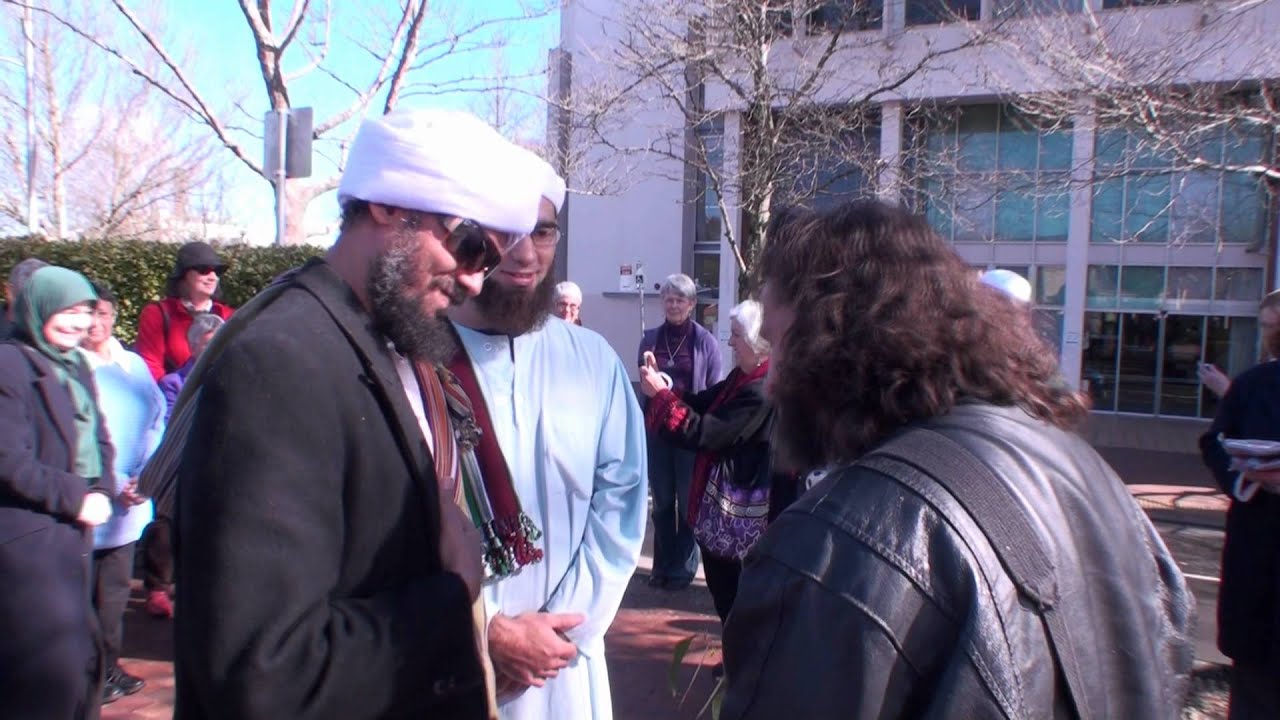 Habib Kadhim presenting a gift