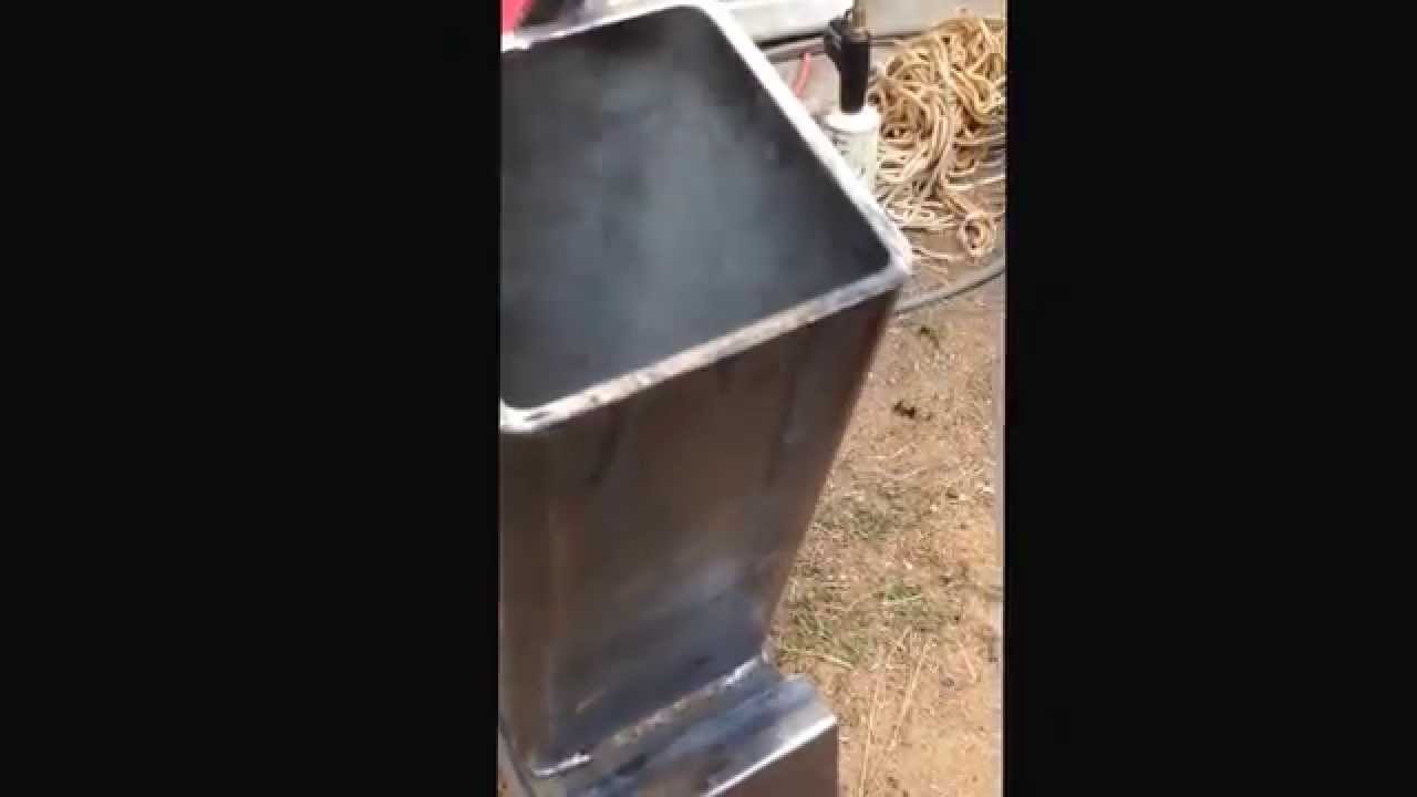 Rocket stove converted from wood pallets listen to it burn