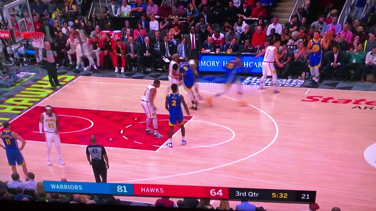 Stephen Curry shoot a three pointer from his knees underhanded. Unbelievable