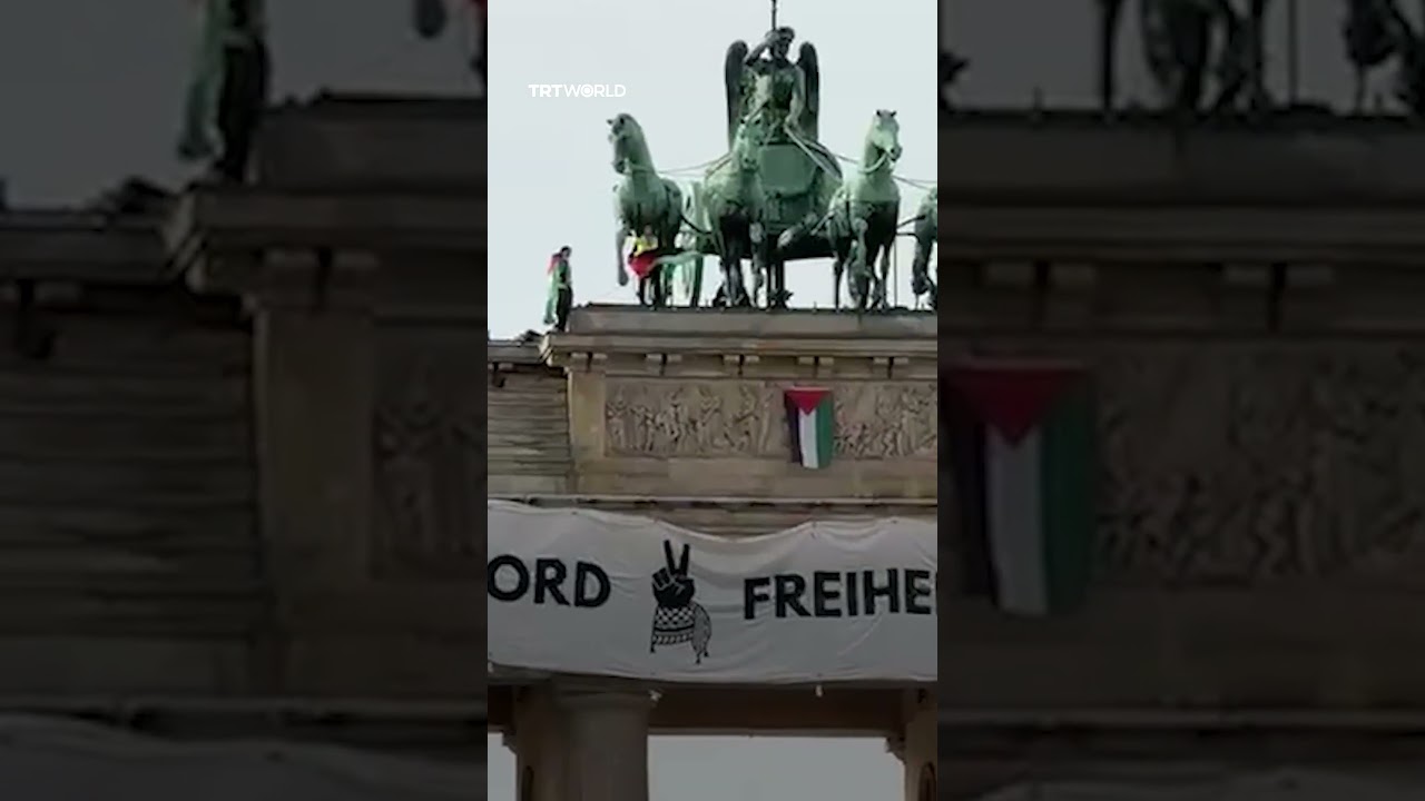 Activists climb Germany's Brandenburg Gate to protest the country's complicity in Gaza genocide