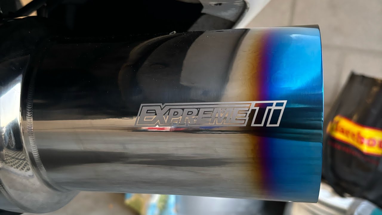 Installing the Tomei muffler on my RX-7 FD.