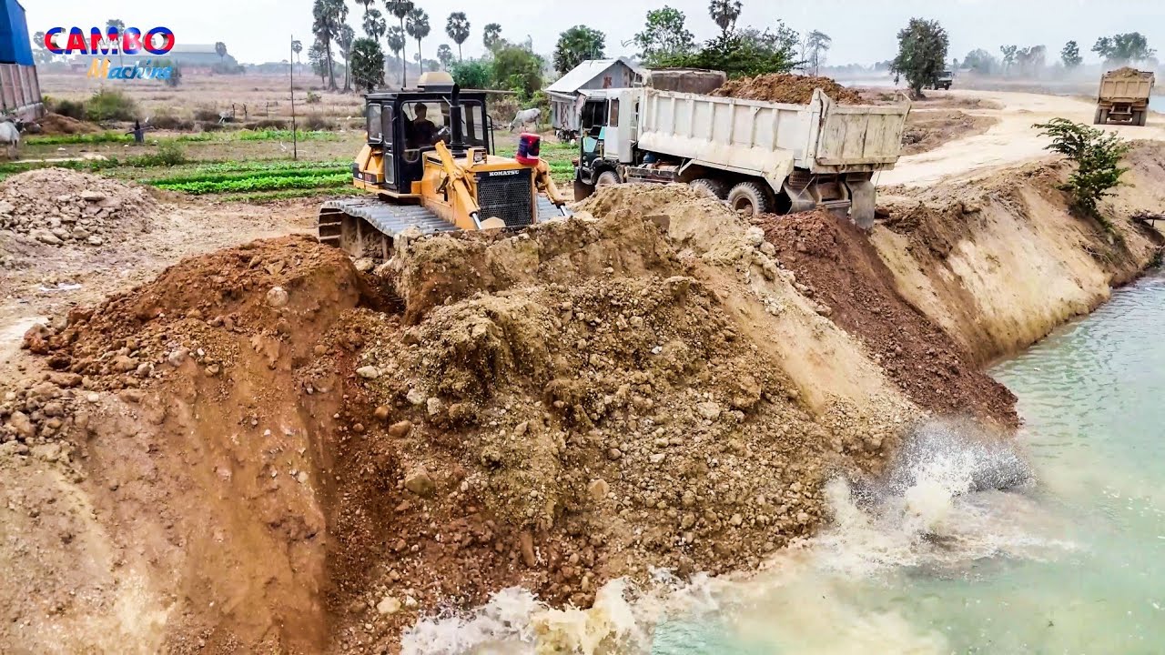 AMAZING Dump Trucks Unloading Soil into Deep River to Rezise ROAD &Pushing Clear using Dozer KOMATSU