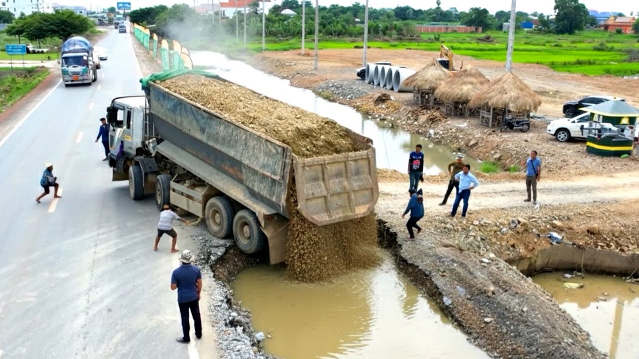 Wonderful Heavy dump truck 25T unloading rock repair road and New bulldozer working push filling up