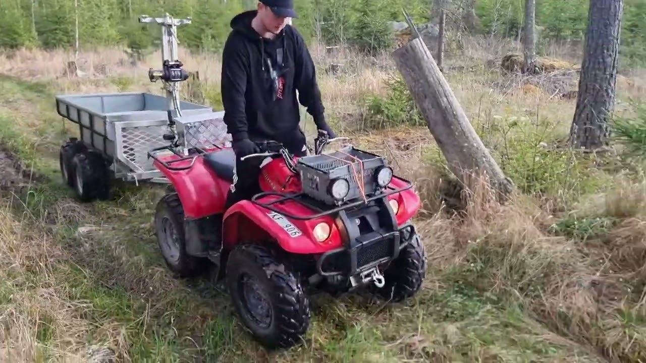 Drive trough the forest ends up with stuck atv.