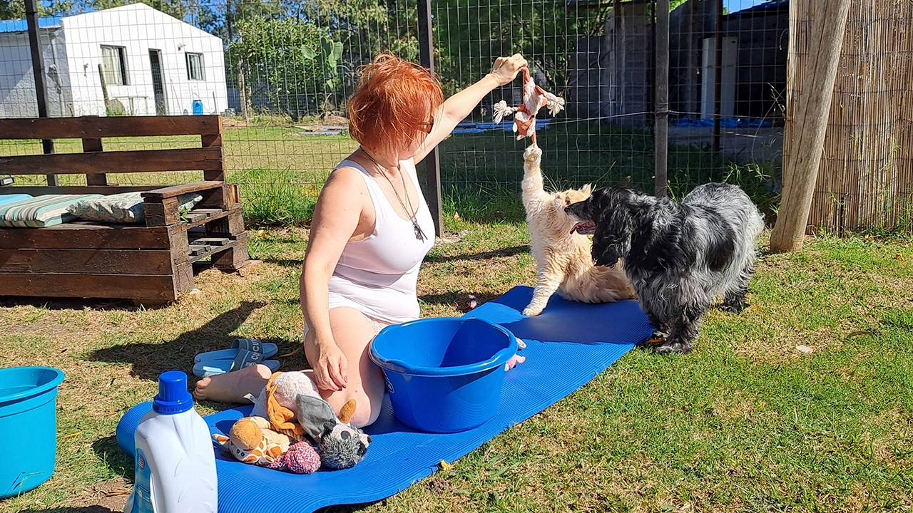 Simple life in Uruguay: Enjoying the sun and garden work. Uruguayan village. Mila Naturist