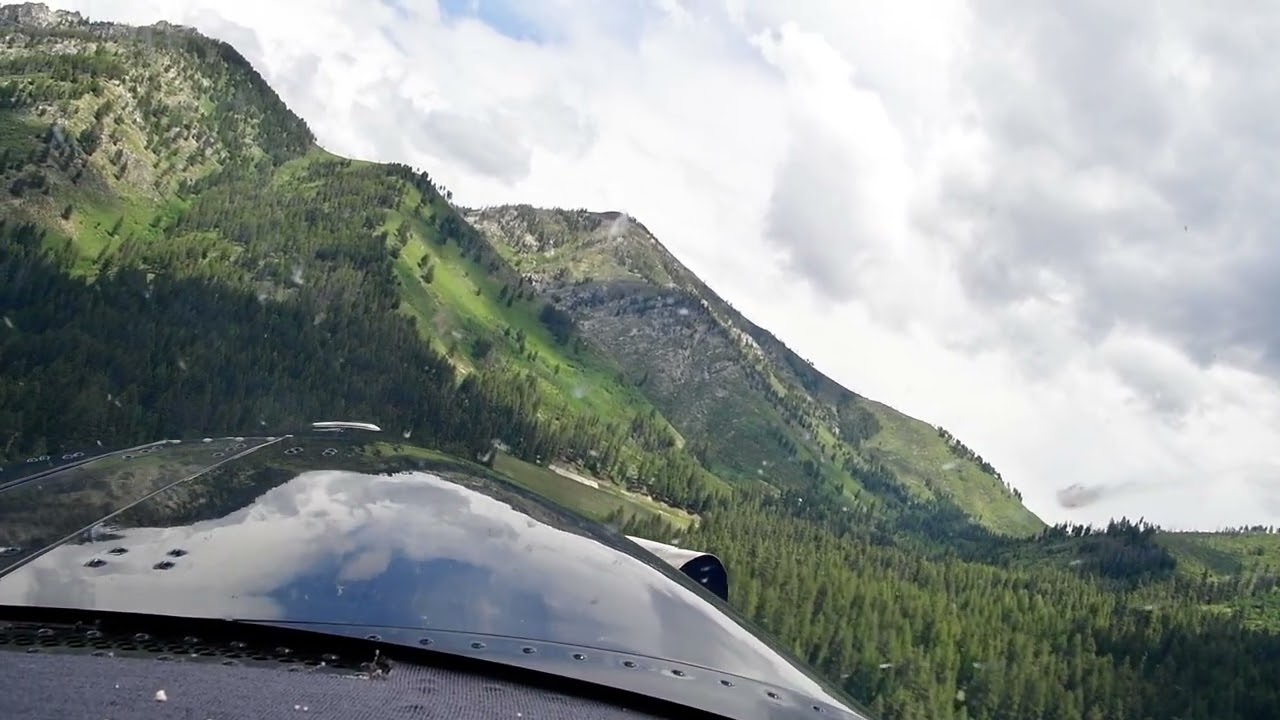 Kodiak 100 departing Atlanta airstrip with climbing left turn, Idaho