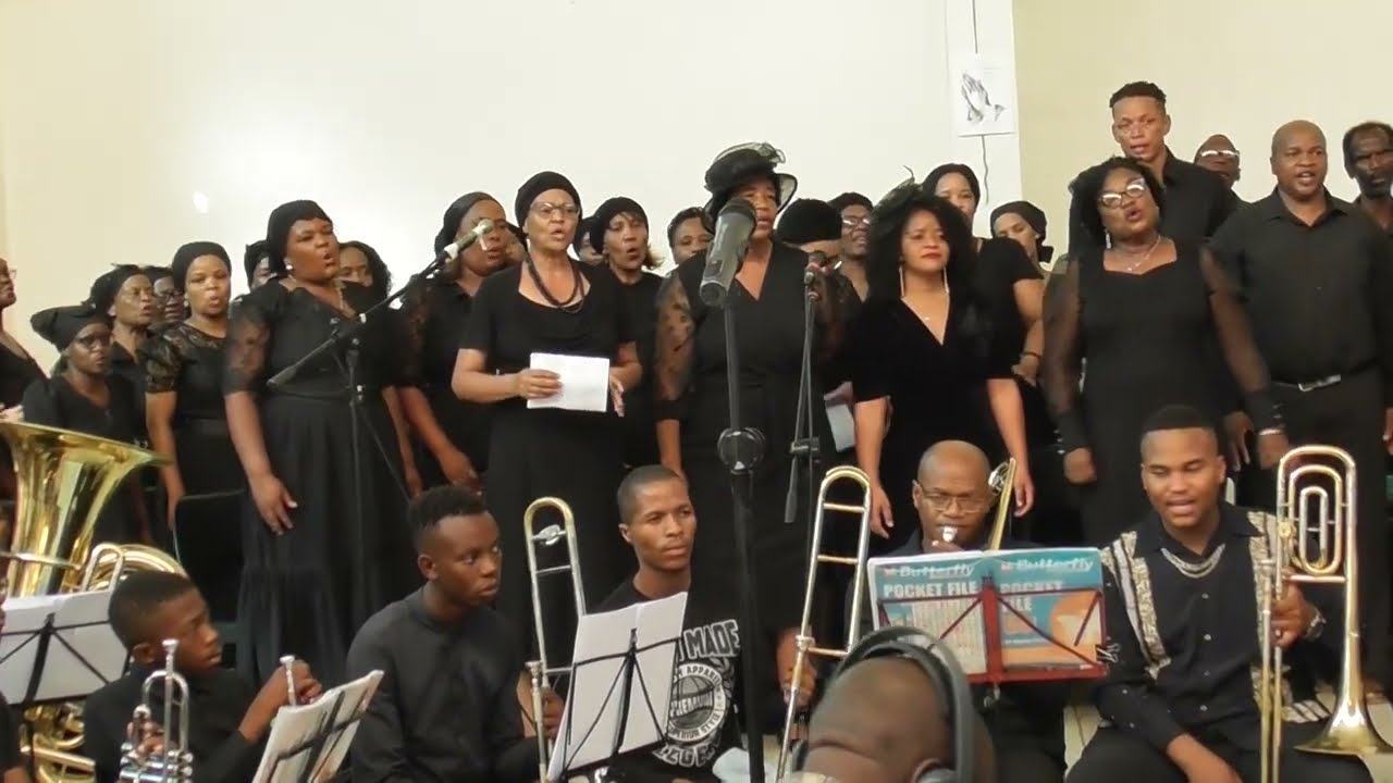!Kheis ge a sa conducted by composer Paul Hatani Kisting with combined brassbands & youths, Namibia