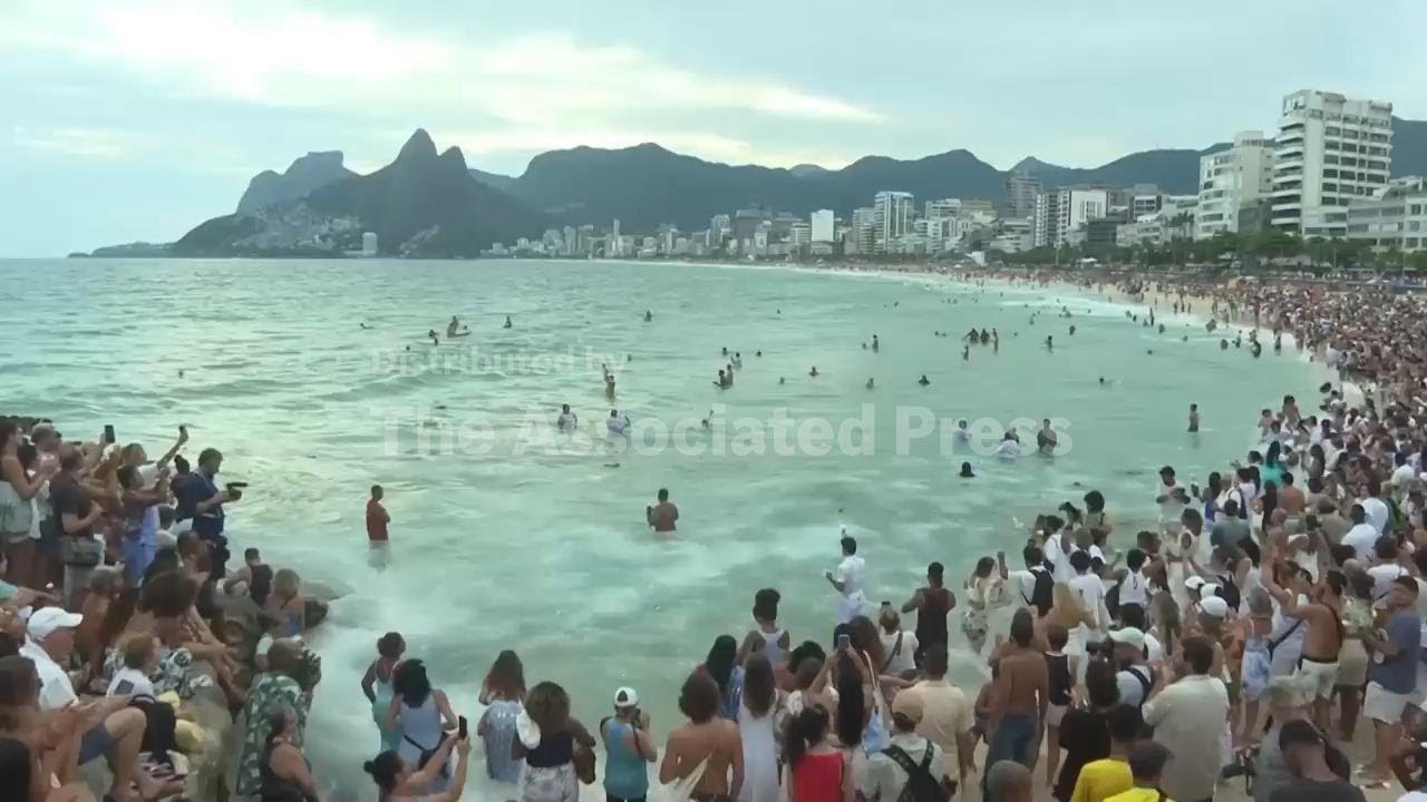 Thousands gather on Rio beach to offer tributes to Afro-Brazilian sea goddess Yemanjá