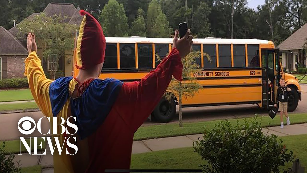 Teen wears silly costumes to surprise little brother at bus stop