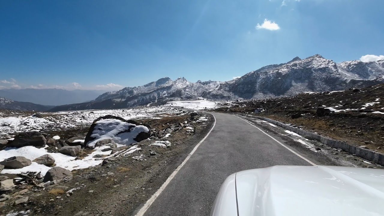 Driving through the snow clad roads of Arunachal .