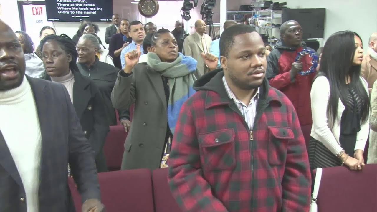 AT THE FEET OF JESUS