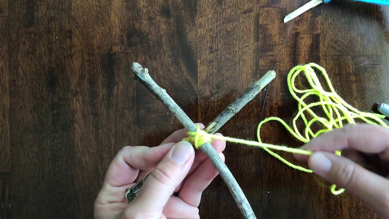 How to make a God’s eye or Tigers eye with yarn and sticks.