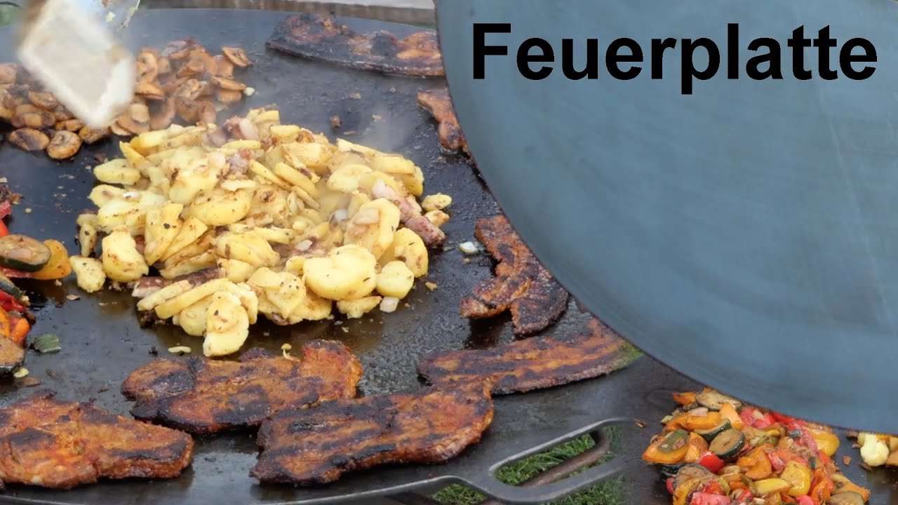 Leckeres Essen auf der Feuerplatte zubereiten