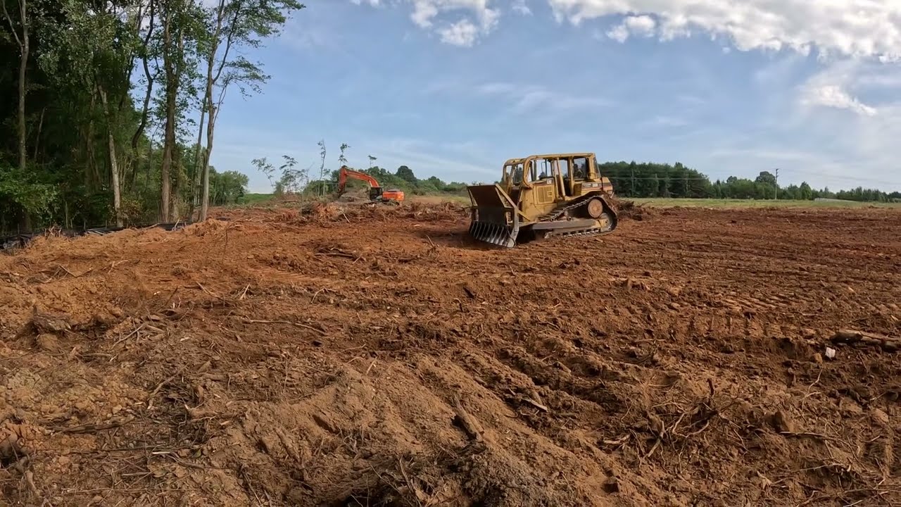 Root raking with a Cat D6R bulldozer