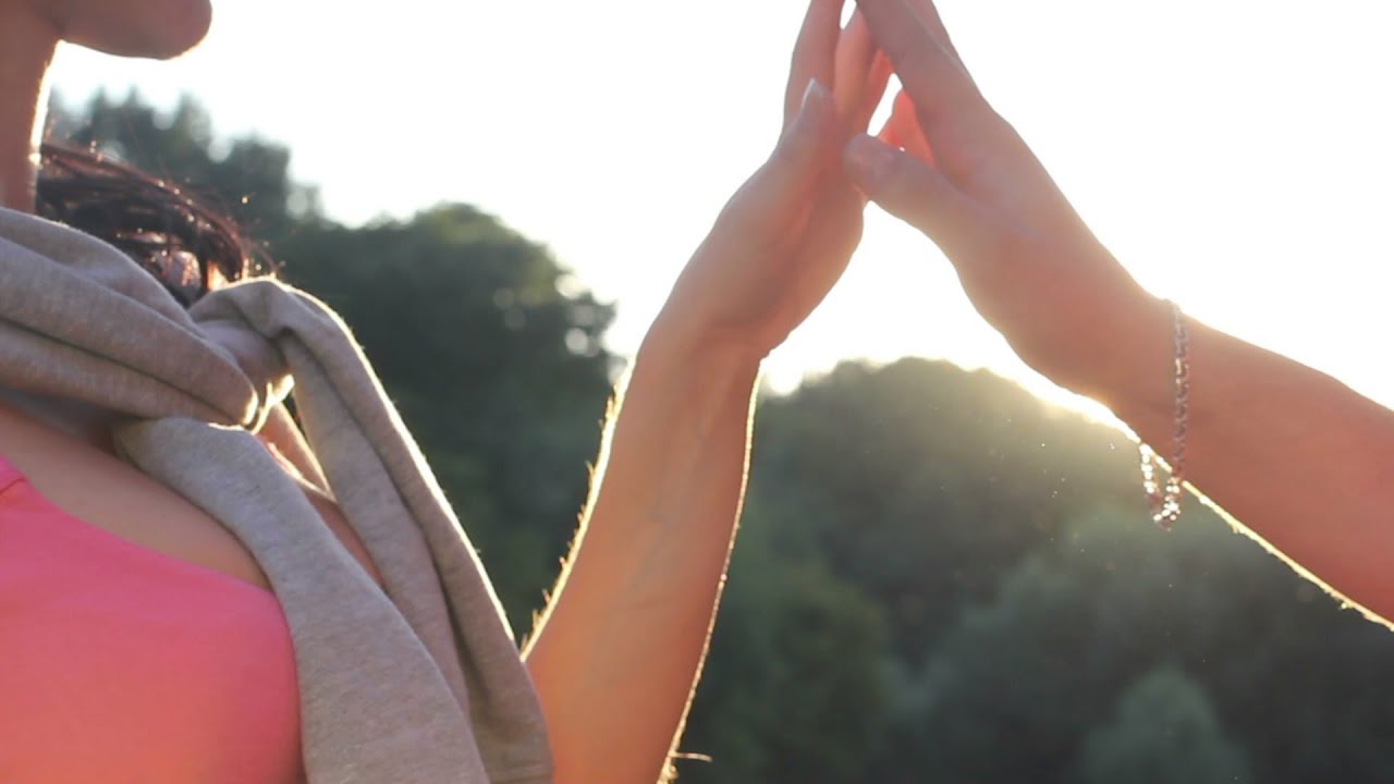 Young couple male and female holding hands, sunshine, sunset. Stock Footage
