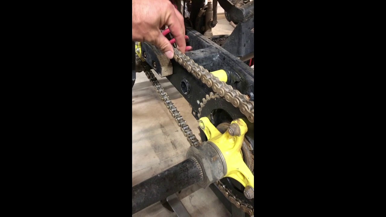 Tightening the chain on a Suzuki LT-R450