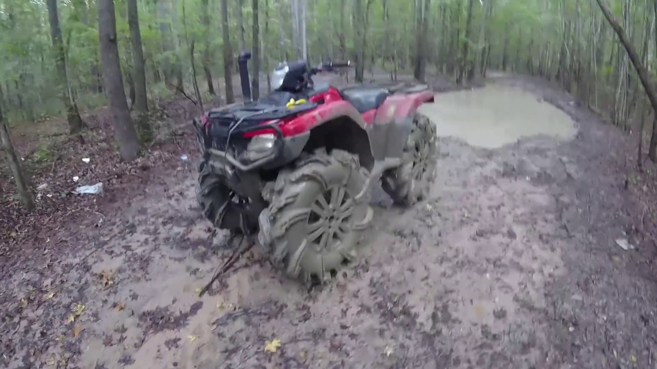 giant 34.5 outlaw 2 on little honda rubicon deep mud and water and flip