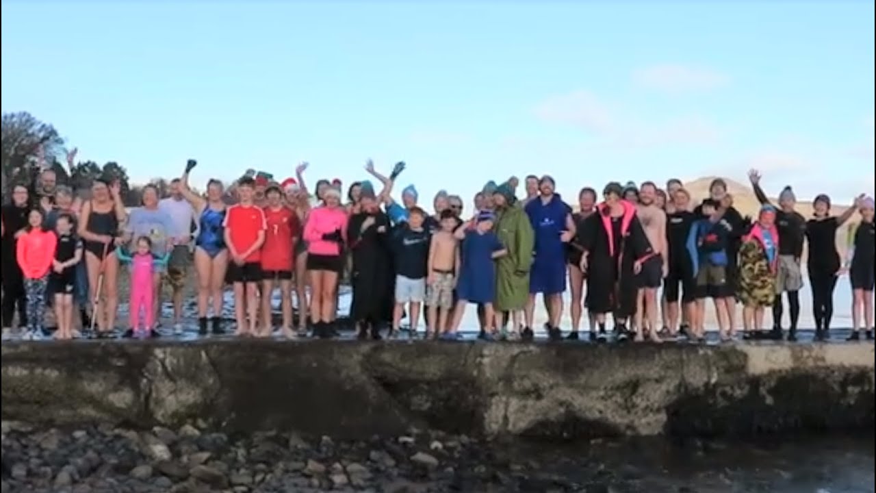 Whiting Bay New Year's Day dook in the sea at the pier, Arran 2024@davetheraverovingtherock