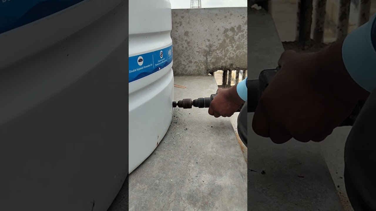 plumbing works making a water tank hole||with drilling machine|| #plumbing || #construction||