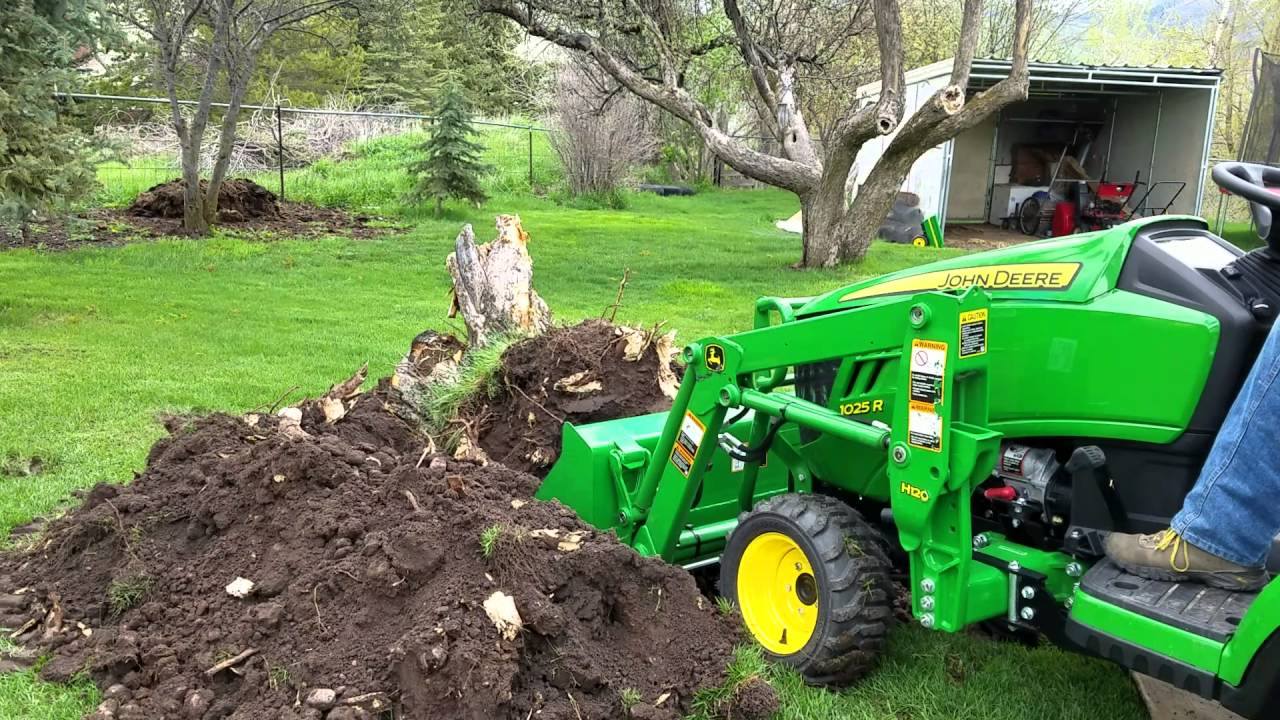 Apple tree stump removal with new john deere 1025r tlb