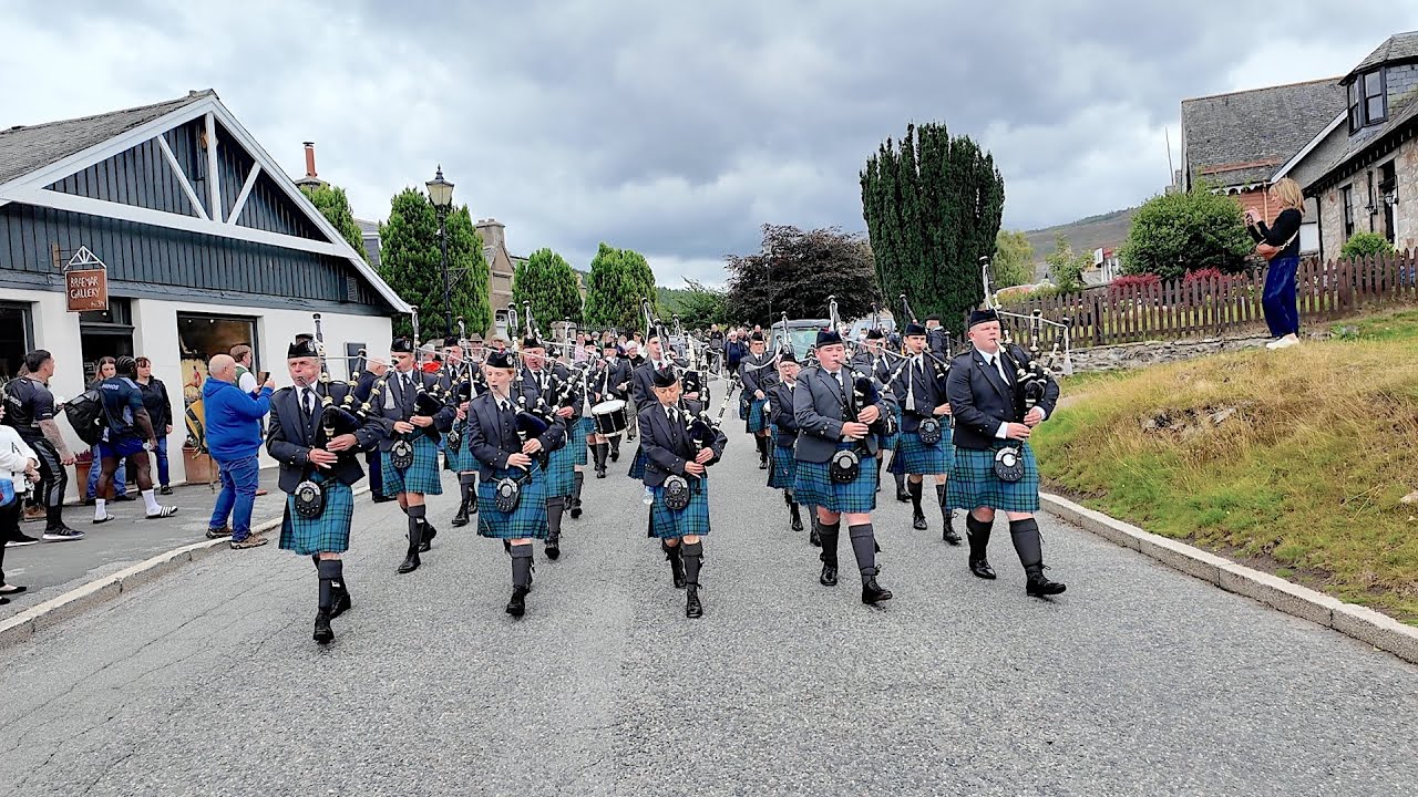 Dunnottar Pipes & Drums playing Crags of Tumbledown on march to 2025 Braemar Gathering in Scotland
