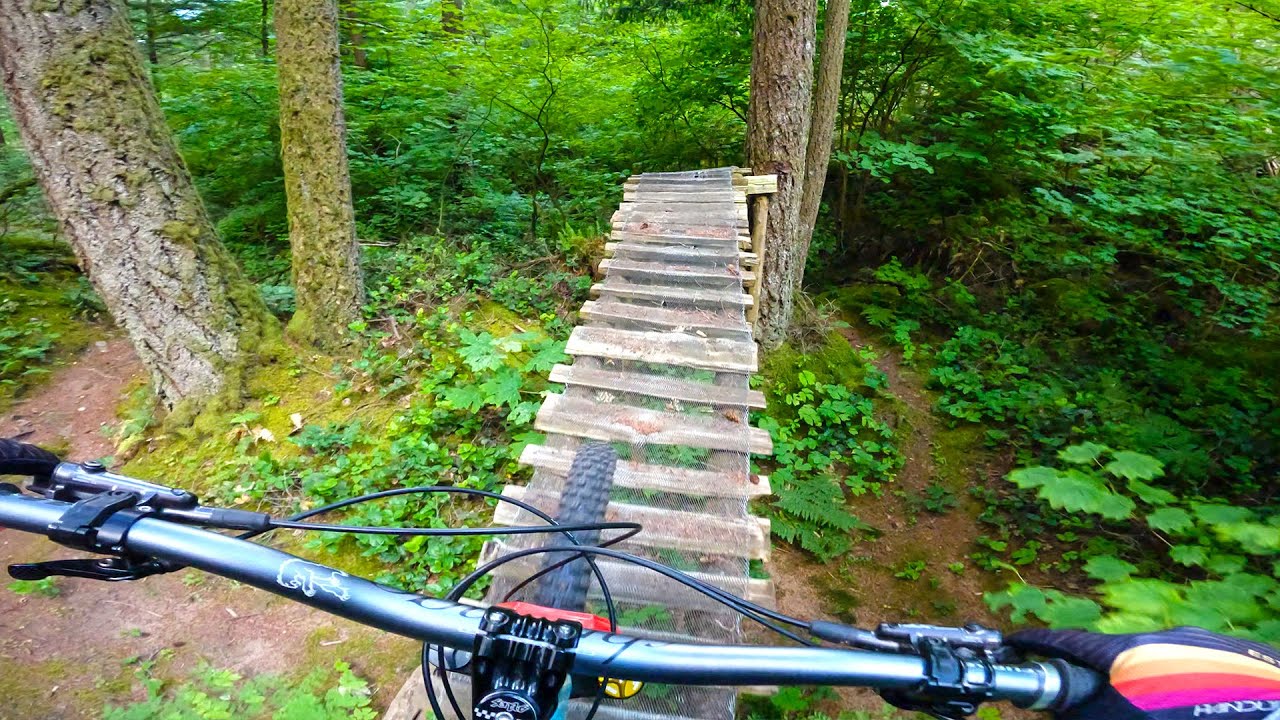 Attempting a jump off a rock onto another mossy rock wall ride...