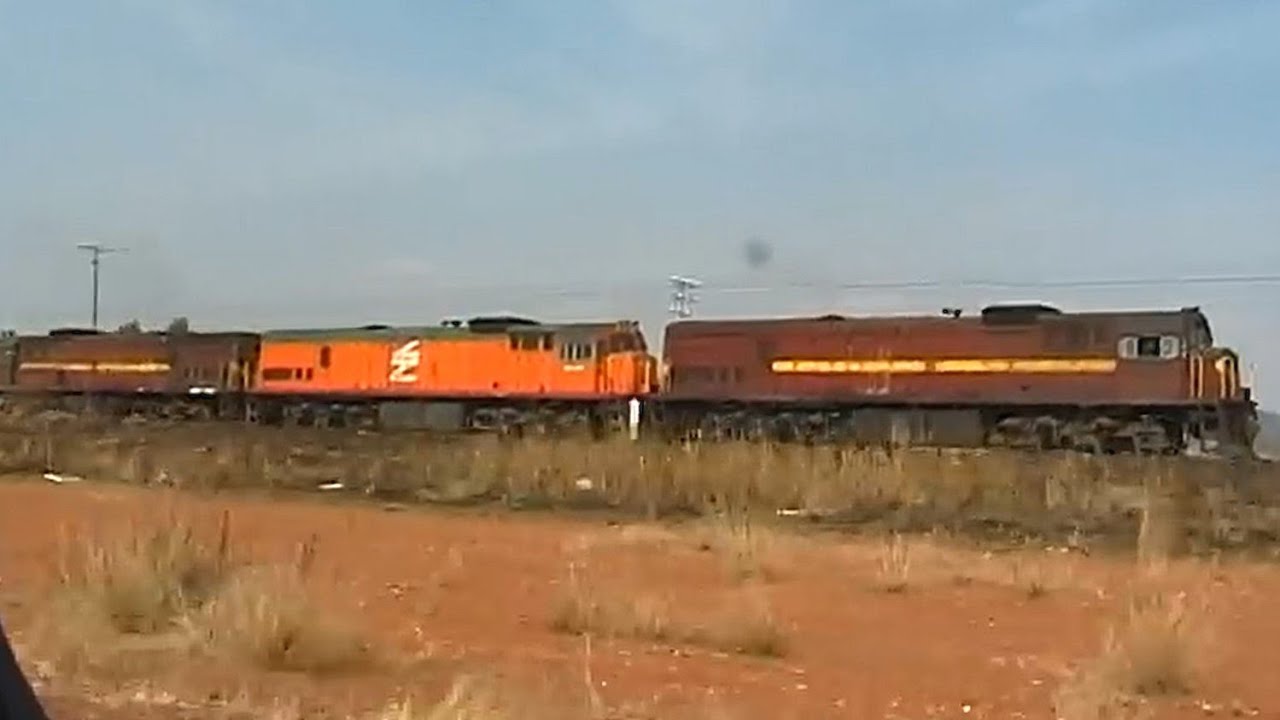 Four Spoornet/SAR 34.4 locos near Magaliesburg
