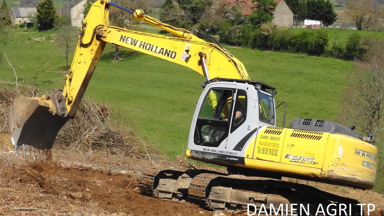 Défrichage / NEW HOLLAND E215 / SARL Paille Bélot Fourrages