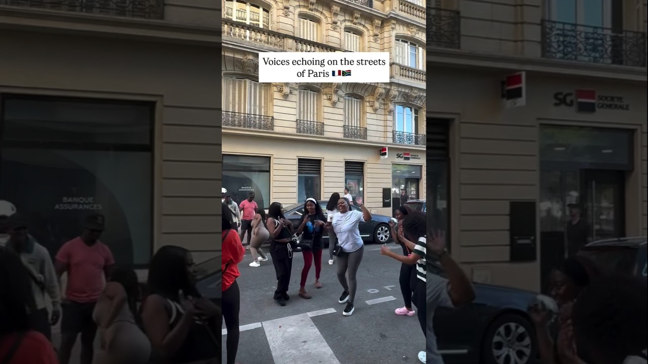 South African students singing Uthando in the streets of Paris by Thanda Choir