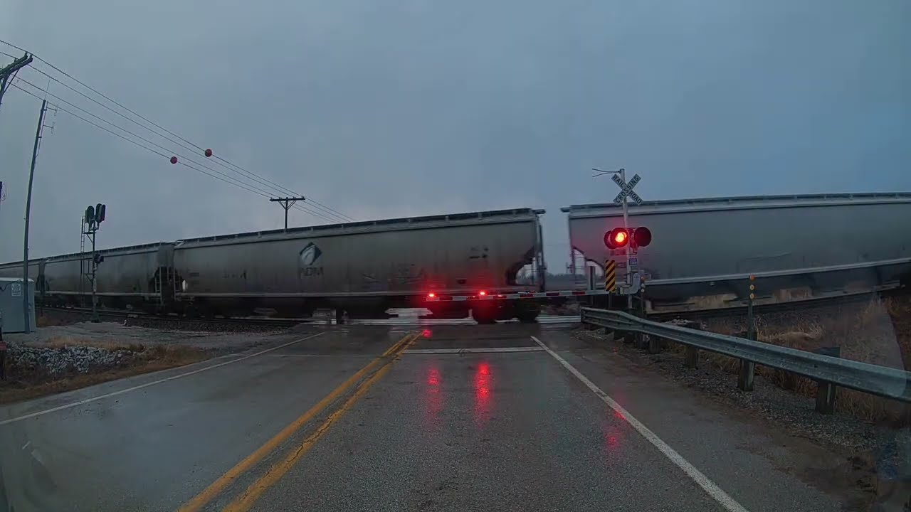 Southbound UP train with 35 freight cars in the rain north of Elkhart, Iowa on the Spine Line