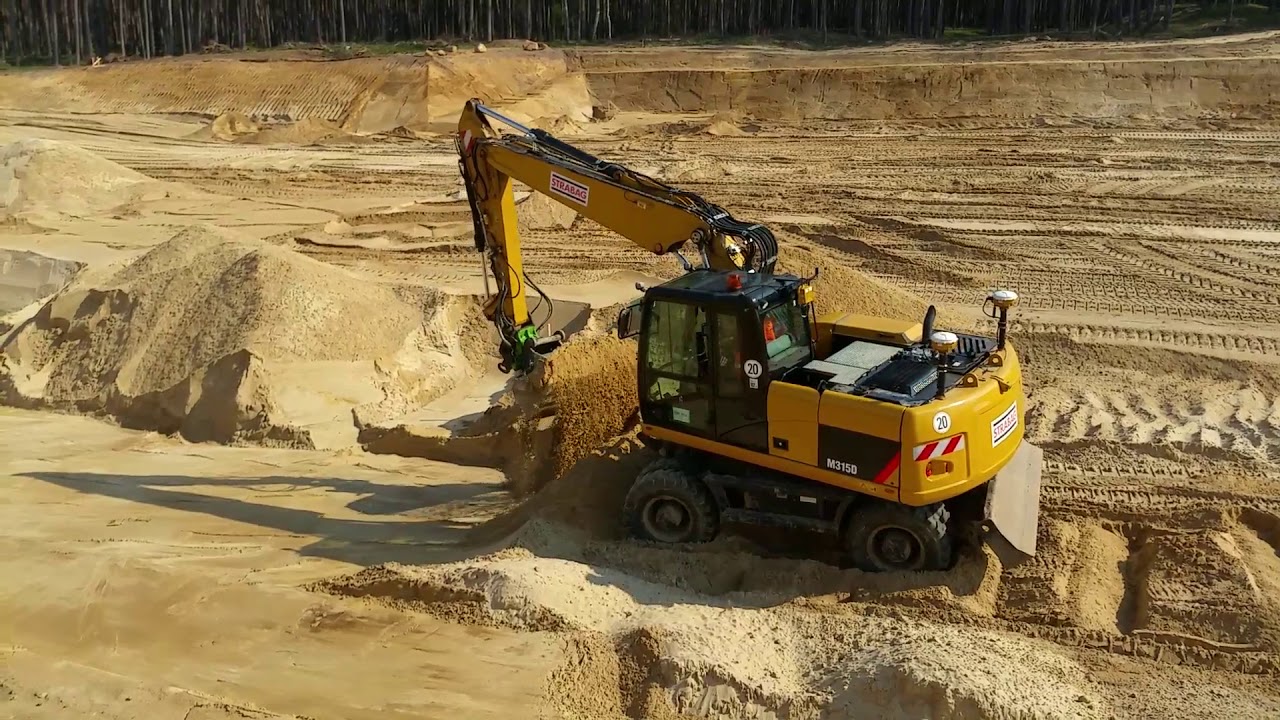 CAT M315D with Trimble Dual GPS doing the batter