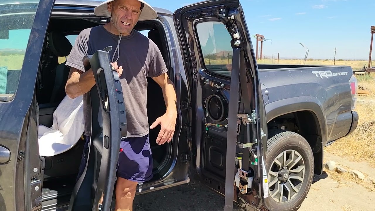 Toyota Tacoma access cab 2016 to 2023. Door panel and seat belt removal. Remove the weatherstripping